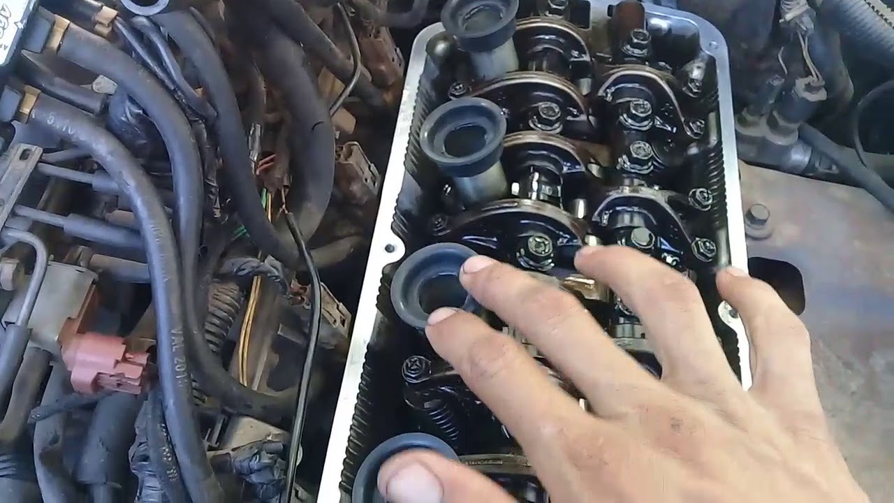 Troca da junta  da tampa de válvula Pajero TR4