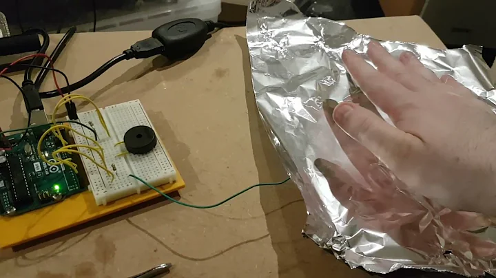 Arduino day 5: *Real* theremin. Capacitance over tinfoil sheet controls pitch of piezo.