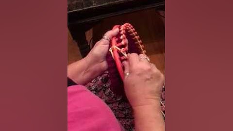 Knitting hats on a loom. Changing colors