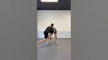 Using front headlock control to complete a pivot snap down.