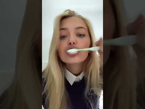 Girl Brushes Teeth
