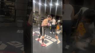 Paul Spadafora and his amateur fighter Andy doing pad work