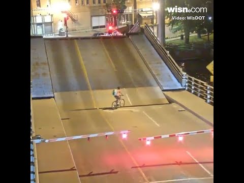 Video shows bicyclist falling into Wisconsin draw bridge