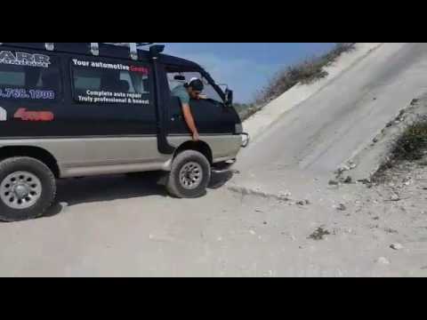 Mitsubishi Delica L300 climbing a steep cement grade