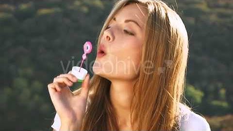 Funny Girl Blowing Soap-Bubbles