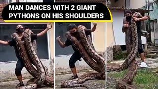 Man dances with 2 giant pythons on his shoulders | Viral Video