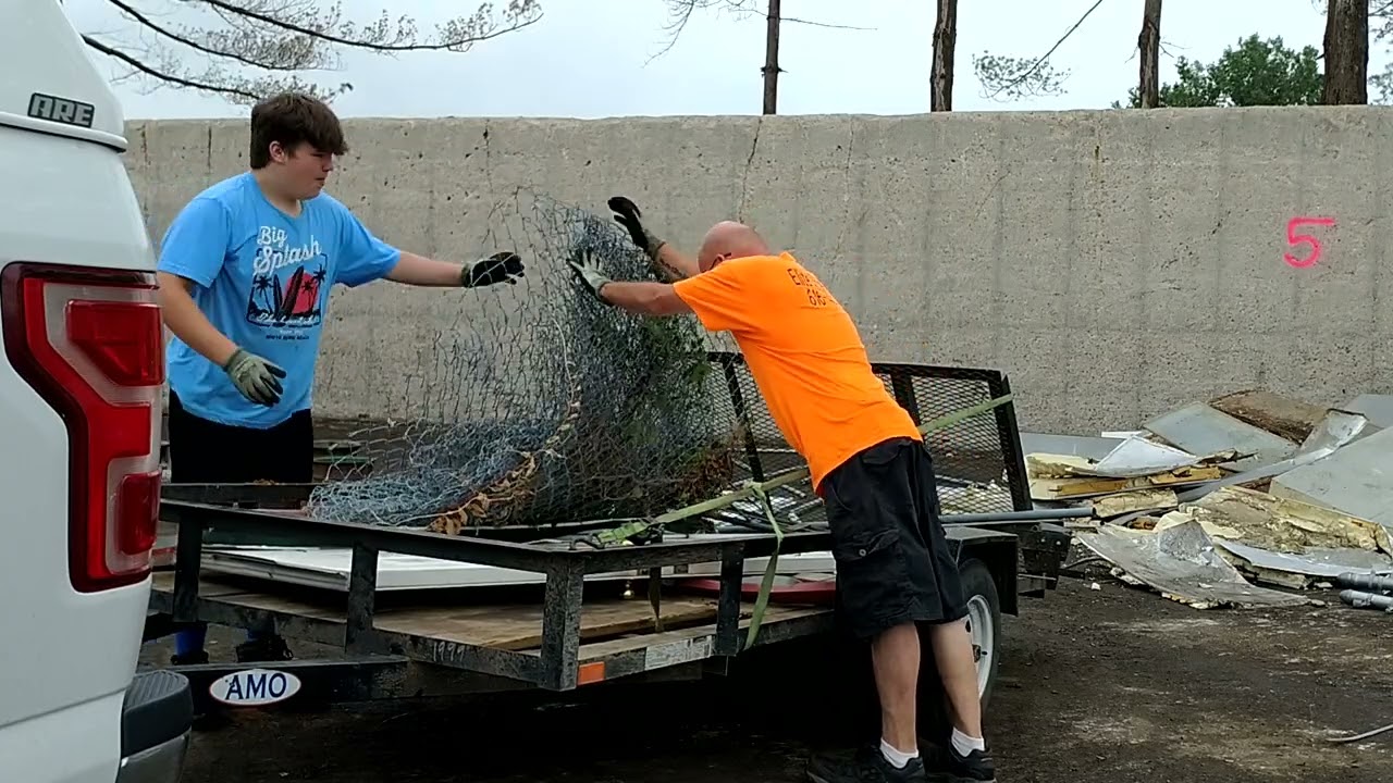 scrap metal drop off of the chain link fence and some random item's