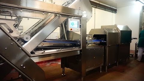 Cured hams sliced on a TS700 slicer at a customer in Germany