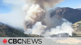 Crews battle fast-growing wildfire near B.C. village destroyed last summer