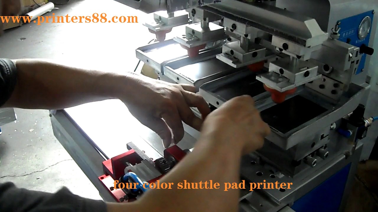 Four color CNC pad printer with shuttle