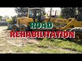 Road Rehabilitation in Main Road Parville-Hoa Prk.4 Bongbong Brgy. Mudiang Operating Heavy Equipment