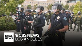 Police inch toward protesters who surrounded UC Irvine lecture hall