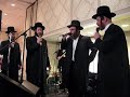 Isaac Honig sings at a Chupah