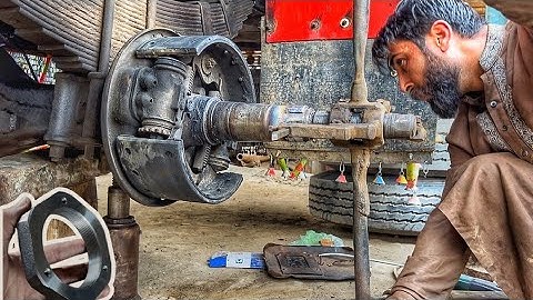 The threads of the mazda truck  rear axle spindle, which had been damaged were rebuilt by hand die