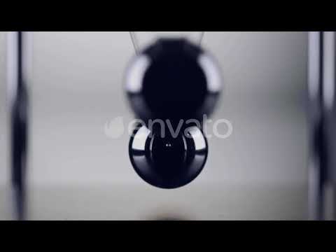 The balls of a Newtons Cradle colliding in slow motion | Stock Footage - Envato elements
