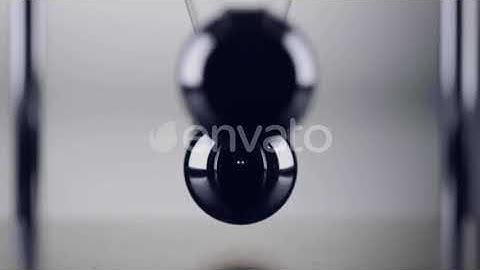 The balls of a Newtons Cradle colliding in slow motion | Stock Footage - Envato elements