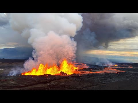 Aerial shots show spectacular view of mauna loa volcano spewing lava