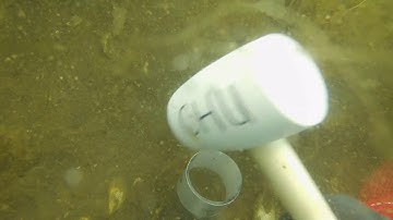 Trying to take sediment cores by SCUBA