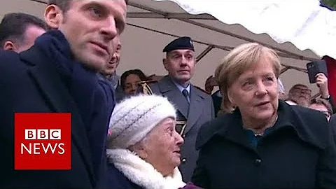 Old lady mistakes Chancellor Merkel for Macron's wife - BBC News