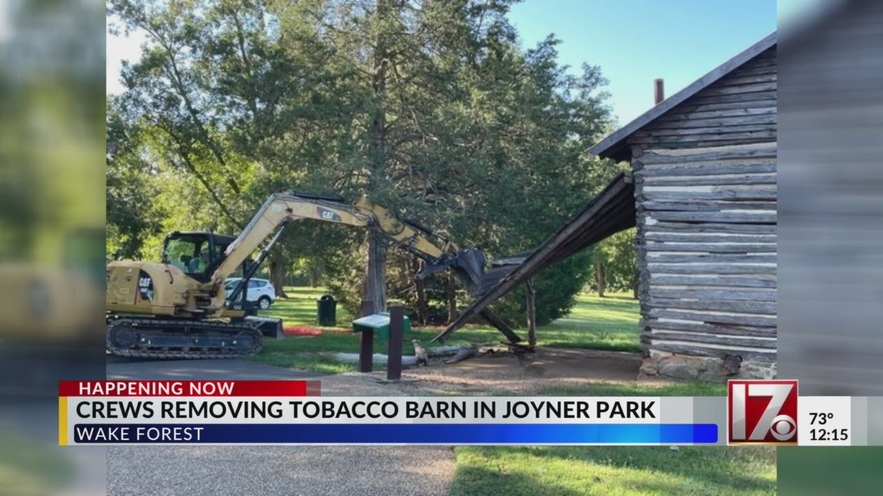 Crews removing tobacco barn in Joyner Park