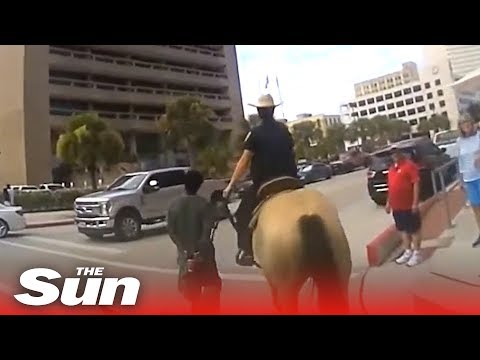Police on horseback march black suspect through Galveston, Texas