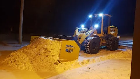 Deere 444H Wheel Loader with 14' ProTech Snow Pusher, plowing 2" of snow