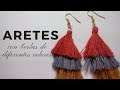 Cómo hacer aretes con tres borlas.