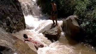 Mountain village । the village boys bath in the river flowing from the top of the hill