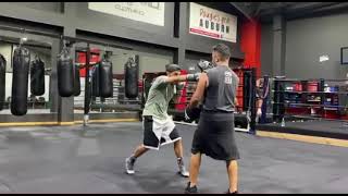 Billy Dib hitting pads with trainer Billy Hussein