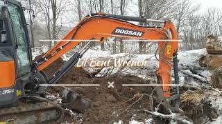 Digging a stump with a Doosan