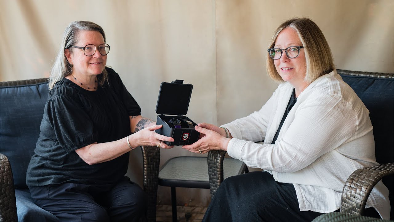 Cathy Daniel received the new Luminox Pacific Diver 3120 from the hands of Rhonda Riche