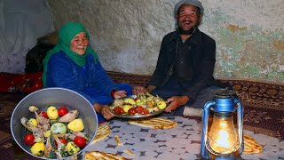 Ageless love, old couple Cooking Chicken Rosh in Bamyan Cave