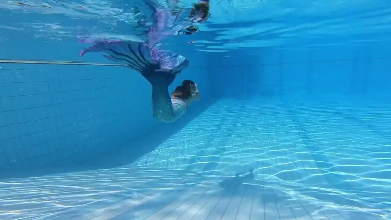 Follow Me Around in a Finfolk Aqua Fairy fabric tail