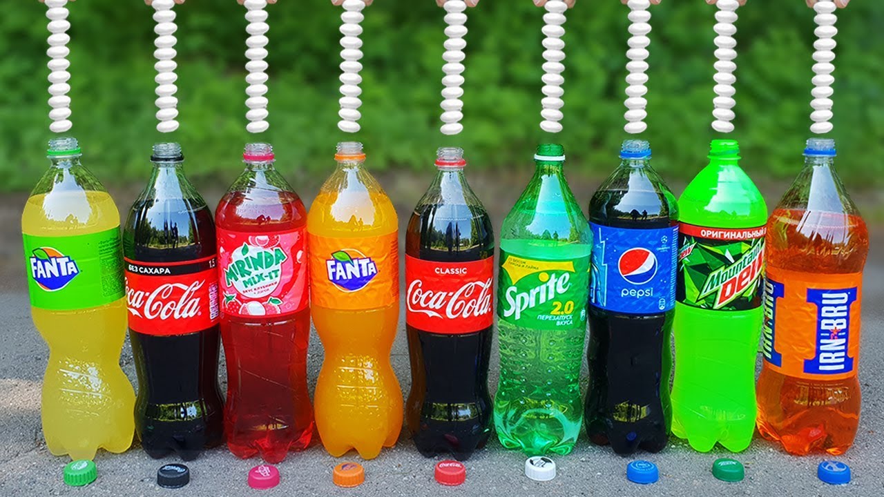 Bottles of global soft drink brands including products of Coca