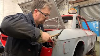 Dent pulling on a classic Lancia Sports Coupe