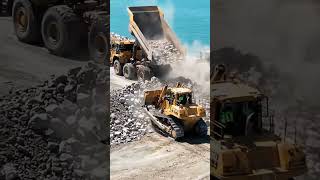 Seawall Construction In Action Dump Trucks Reinforcing The Breakwater