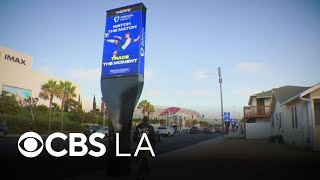 One of Southern California's biggest entertainment hubs has become a battleground over billboards