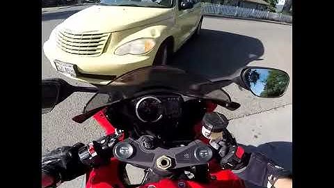 Guy hits motorcycle gets window punched in.