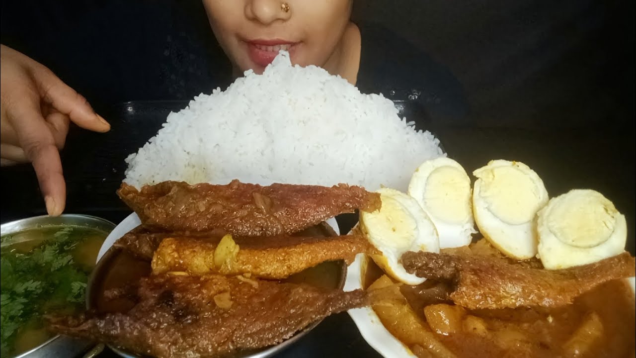 Bigbites eating macher jal musur dal agg carry with rice.