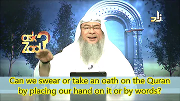 Can we swear or take an oath on Quran by placing our hand or by words? - Assim al hakeem