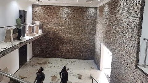 installation of stone cladding here in Ghana _ natural stone design for building ...