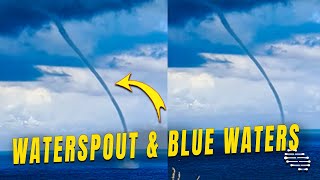 Waterspout Slowly Moving Around the Blue Waters