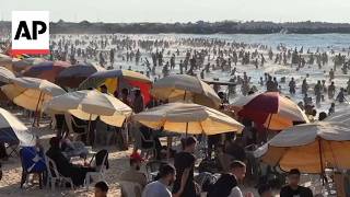 Palestinians flock to the beach in Gaza City to escape the sweltering summer heat Palestinians flock to the beach in Gaza City to escape the sweltering summer heat
