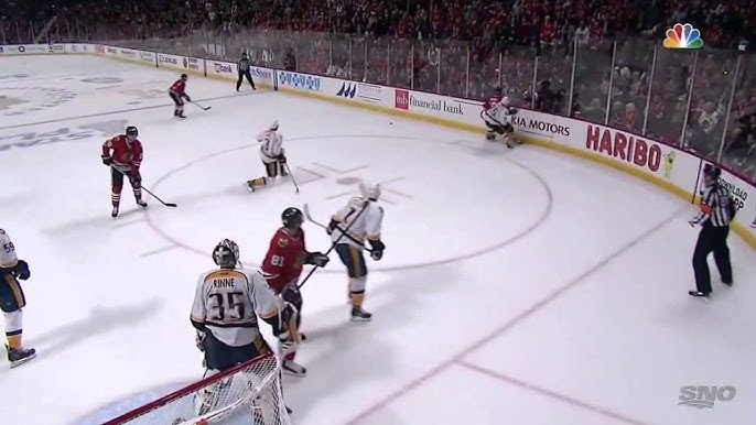 Marian Hossa flattens Brown behind the net 