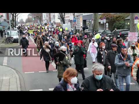 Germany: Protesters march through Dusseldorf against COVID restrix, vaccine mandate