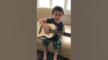 Thumbnail of Milo plays and sings You Are My Sunshine on guitar 4 years old