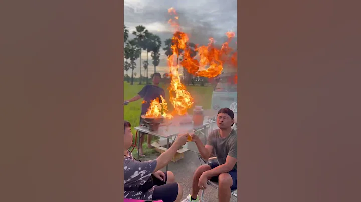 Camping fail as flames from wok splash onto cook's friends
