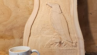 Carving an eagle into a cedar off cut with a dremel.