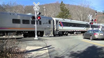 Last video of 2014: 2 NJ Transit trains pass through a 3 gated crossing
