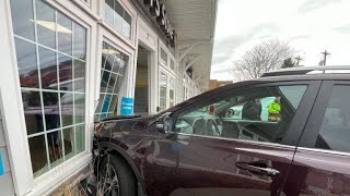 Woman uninjured after SUV crashes into UPS store in North Reading, Massachusetts